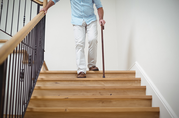 elderly person on stairs