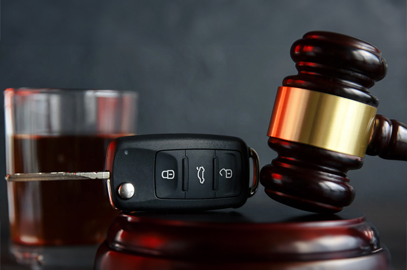 drink, car keys, and gavel