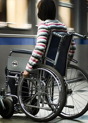 person in wheelchair using lightrail