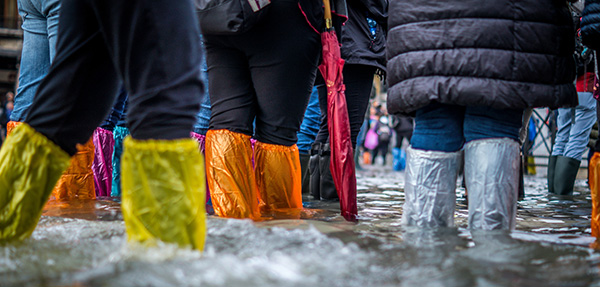 crowd standing in flood water