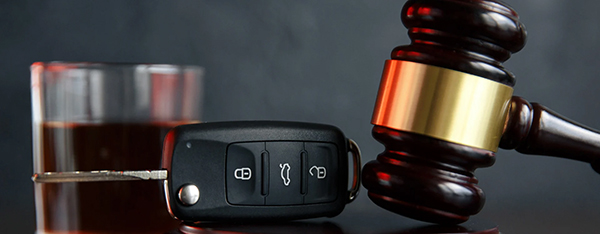 drink, car keys, and gavel